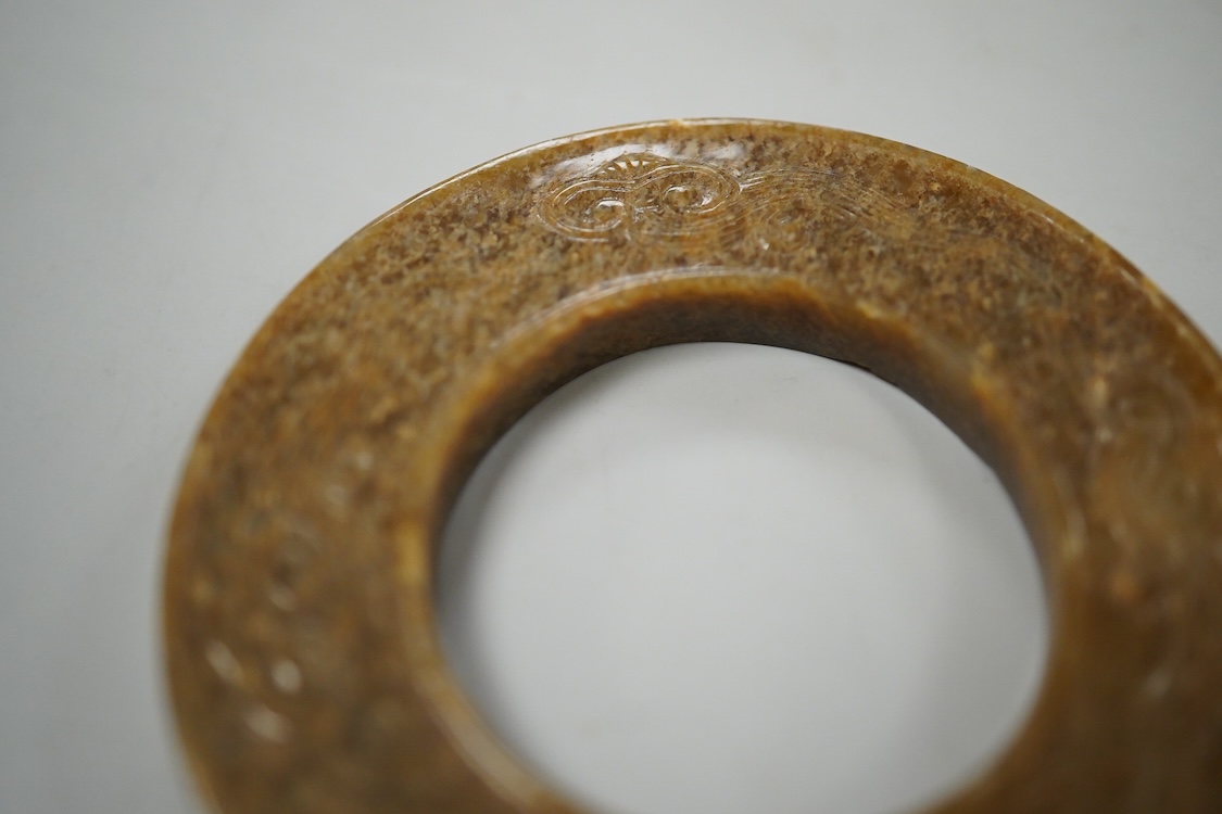 A Chinese russet jade dragon disc, 5.5cm diameter